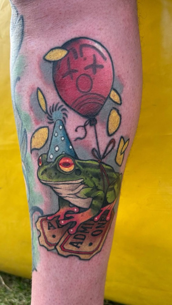 Frog in a party hat with a balloon