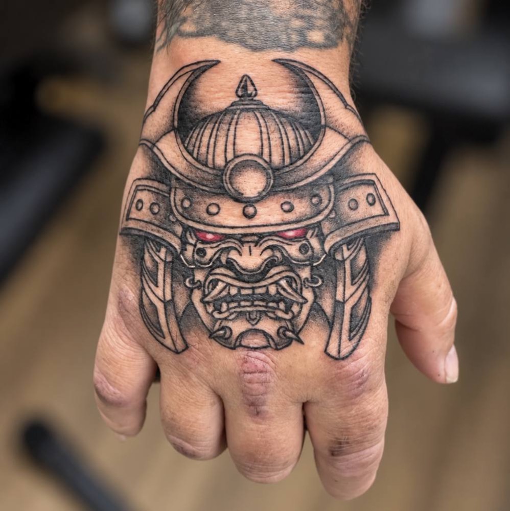 Samurai mask on a hand