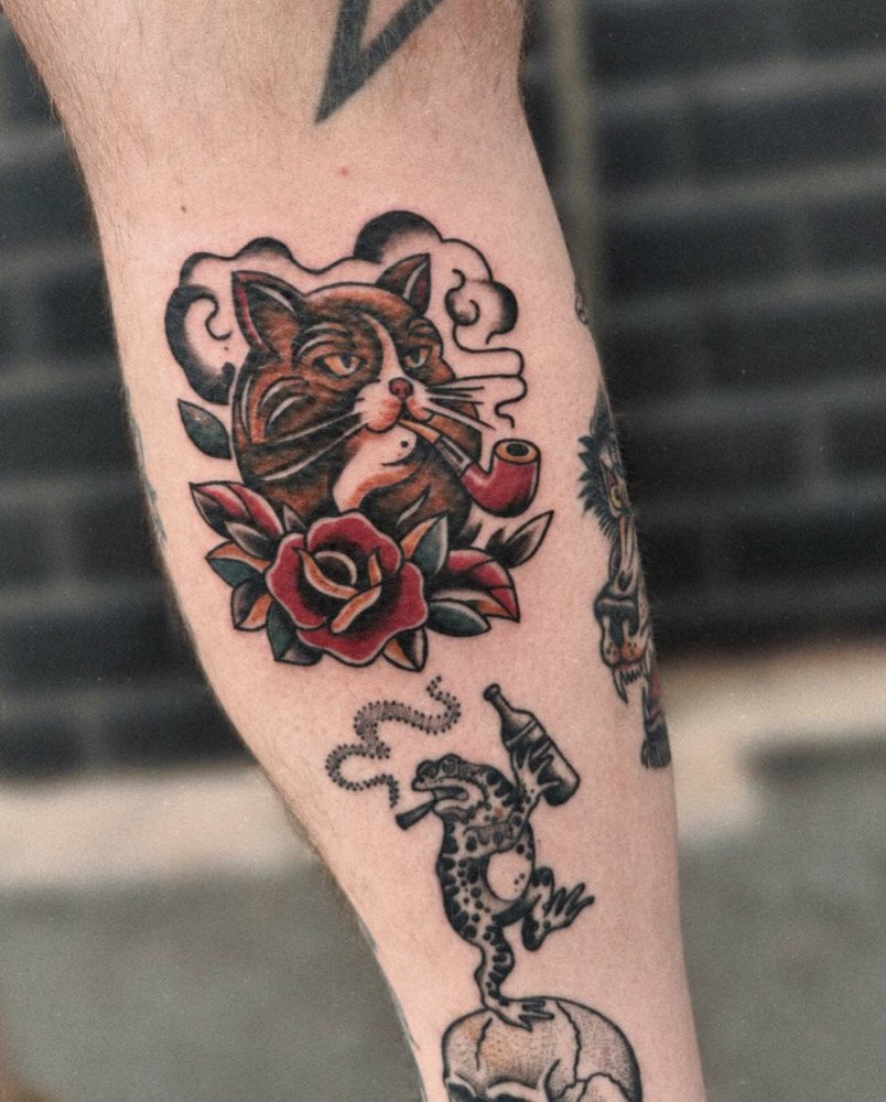 Cat with a pipe and roses